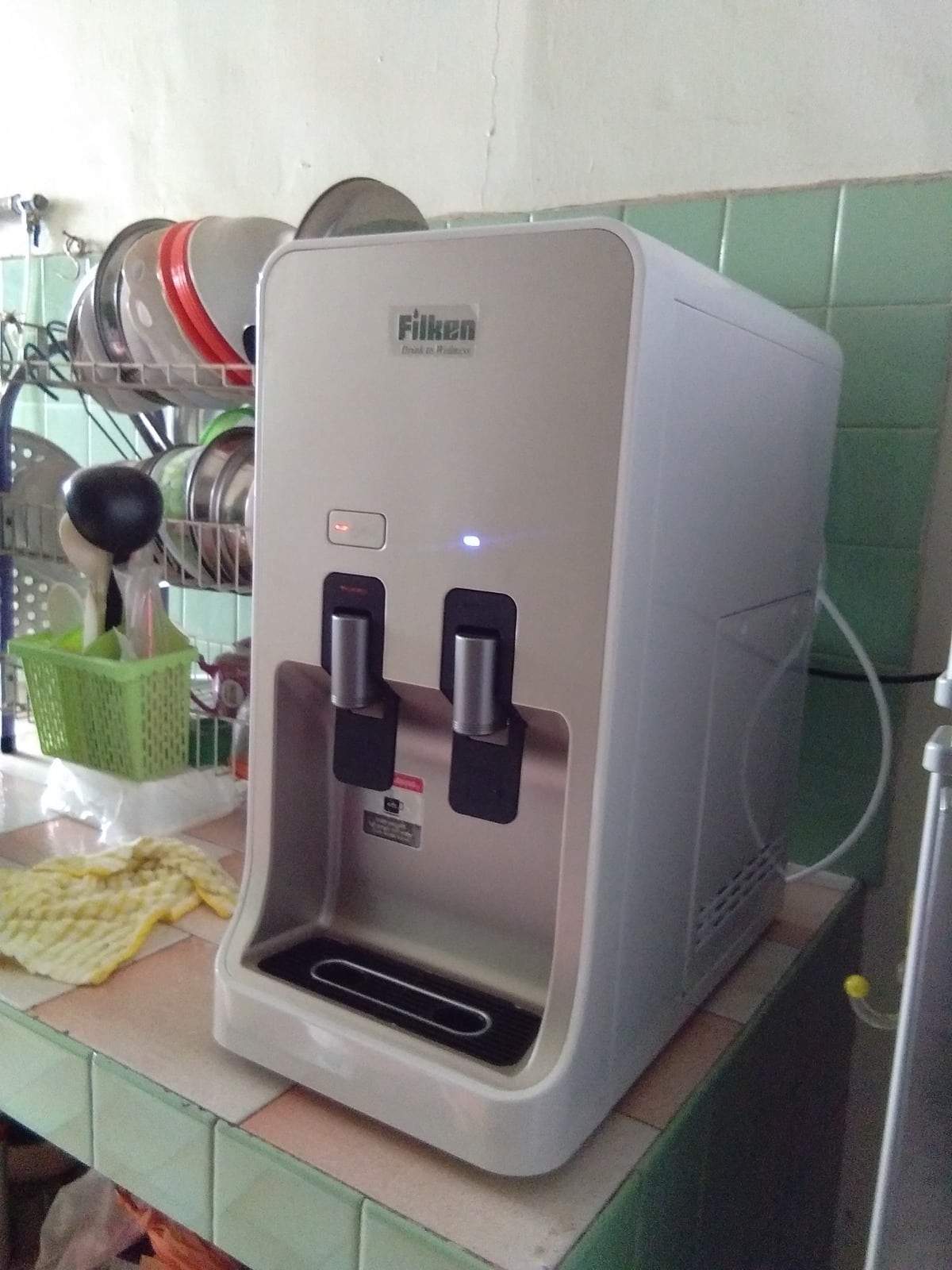 White indoor water dispenser on kitchen counter
